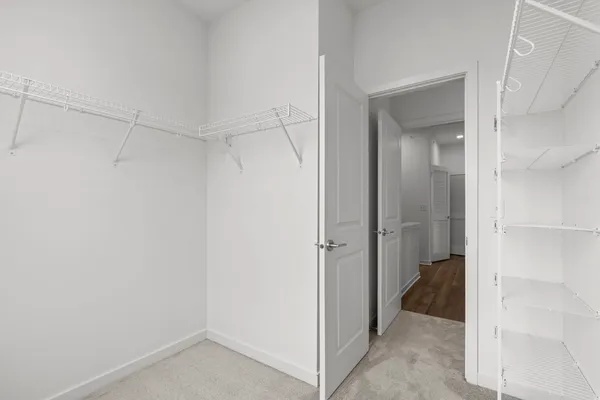 a bathroom with a toilet a sink a vanity and mirror