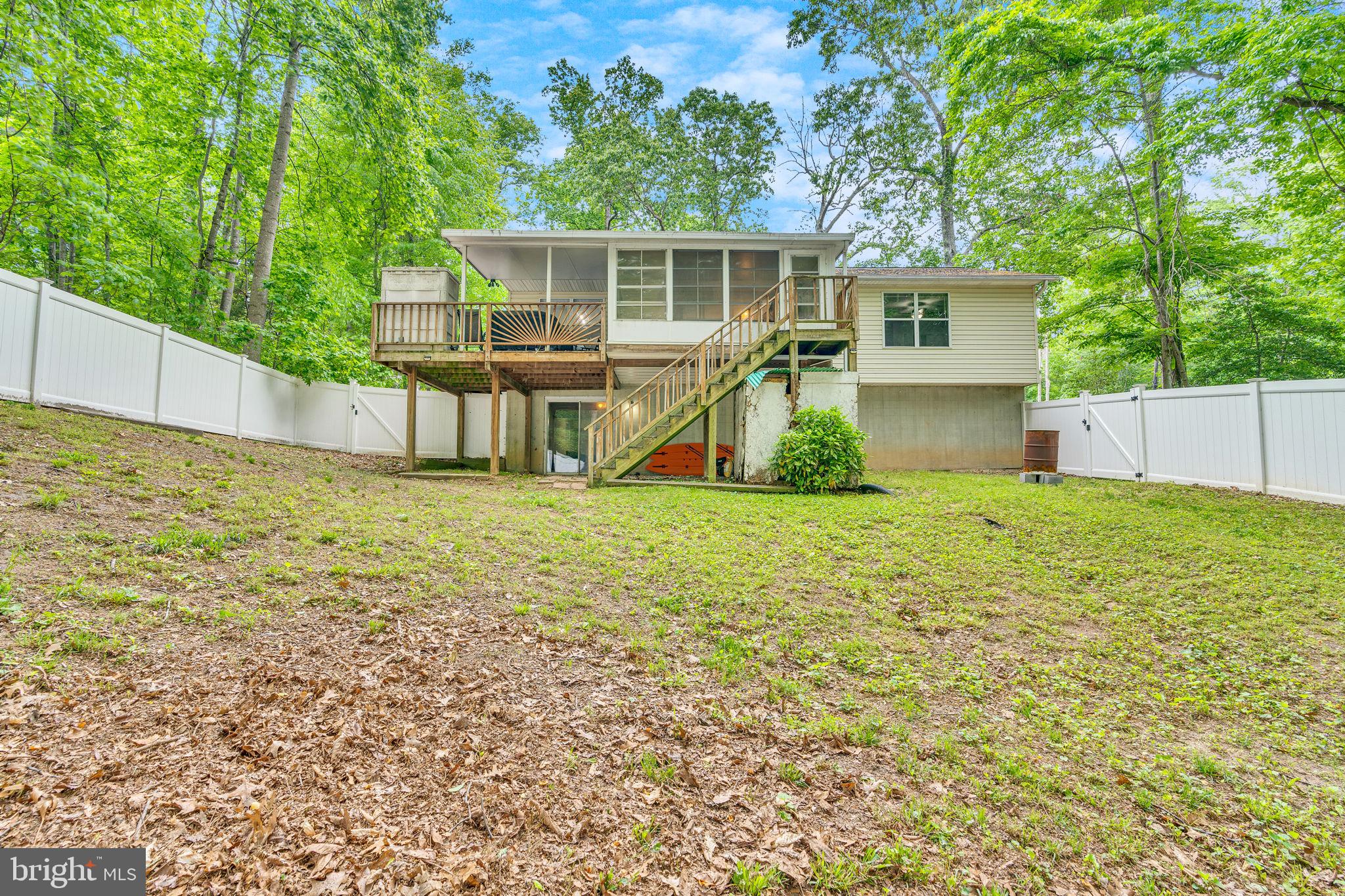 486 Round Up Road Lusby, MD 20657 - Photo 29 of 31 a view of a house with a yard and sitting area