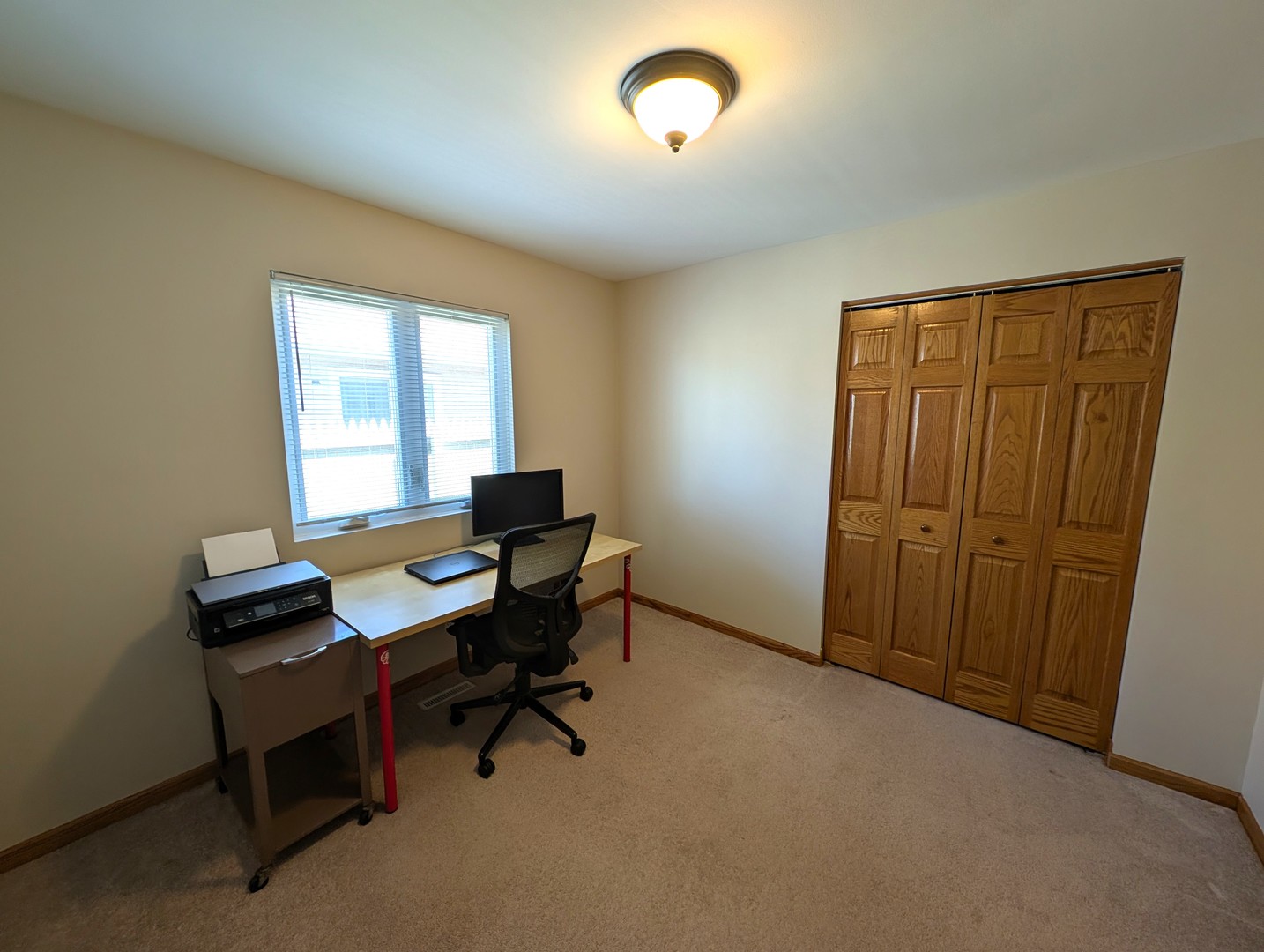 27 Winrock Road Montgomery, IL 60538 - Photo 11 of 19 a view of a workspace with furniture and a window
