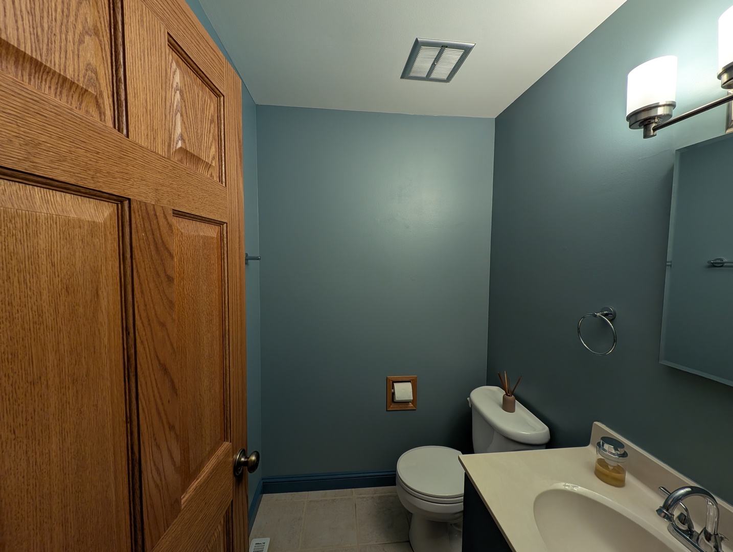 27 Winrock Road Montgomery, IL 60538 - Photo 13 of 19 a white toilet sitting next to a bathroom sink