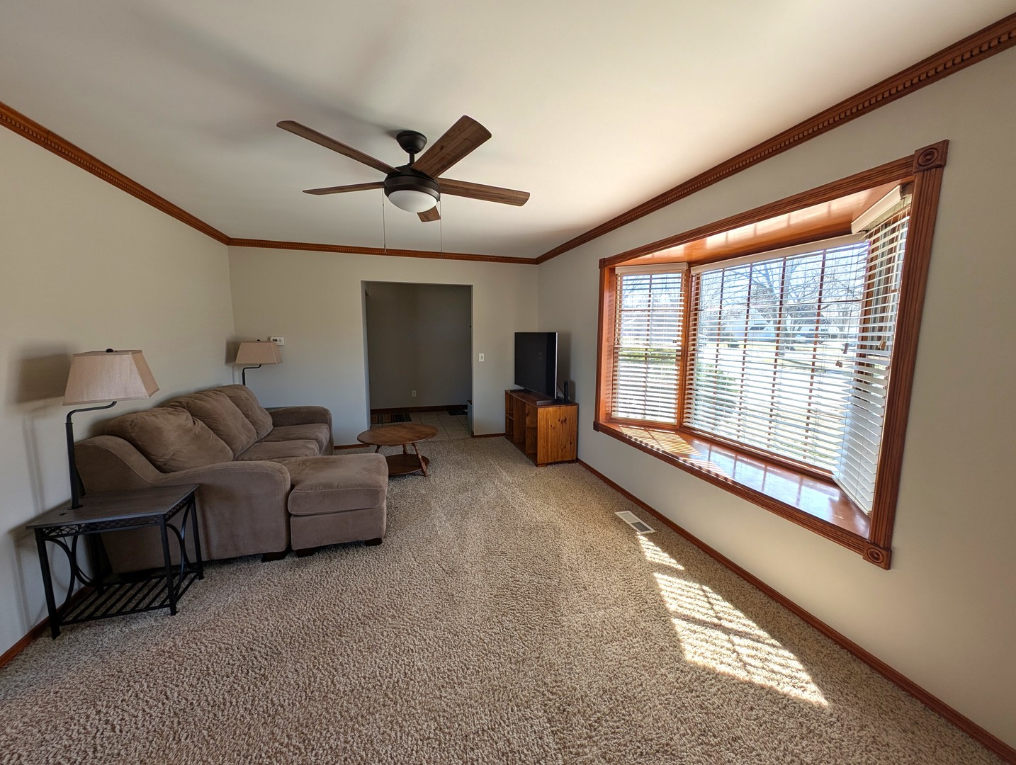 27 Winrock Road Montgomery, IL 60538 - Photo 2 of 19 a living room with furniture and a large window