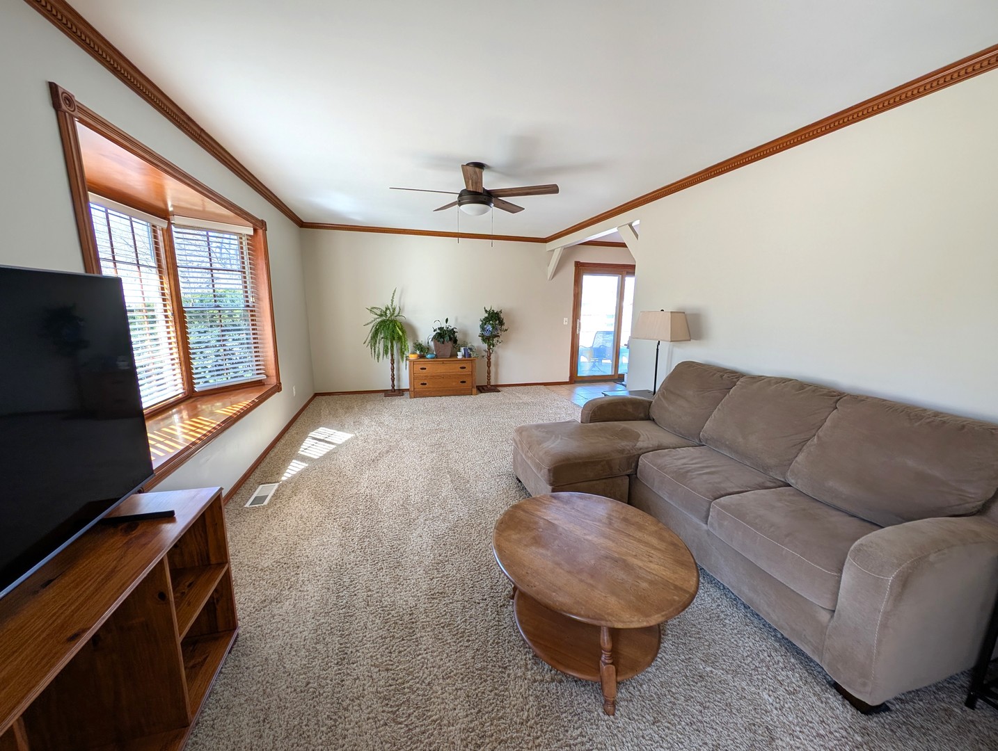 27 Winrock Road Montgomery, IL 60538 - Photo 3 of 19 a living room with furniture and a flat screen tv