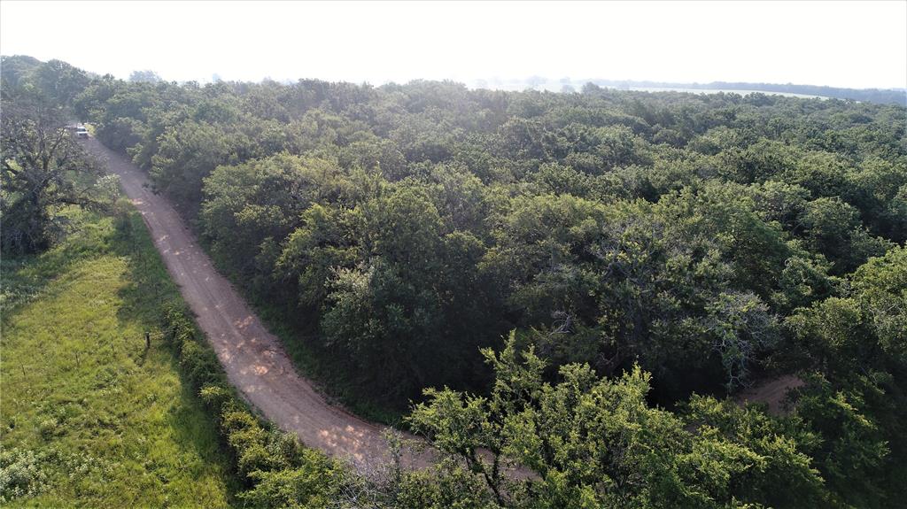 29 Co Road Rosebud, TX 76570 - Photo 2 of 13 an aerial view of residential house with space and trees all around