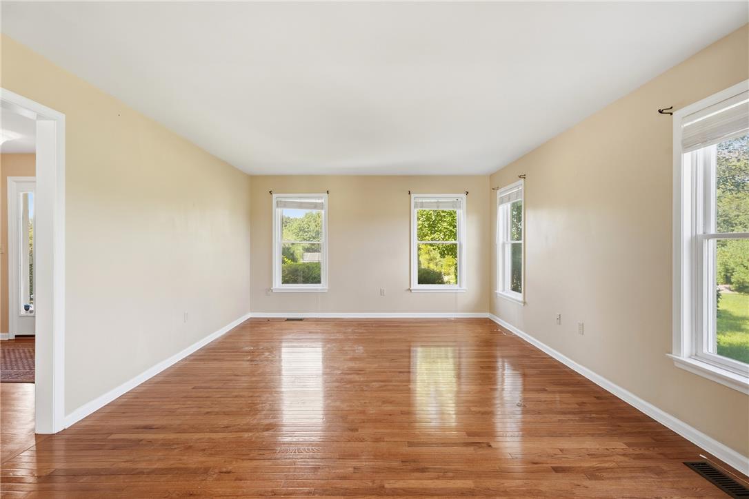 590 Fehr Road Nazareth, PA 18064 - Photo 7 of 79 Polished hardwood floors and multiple windows define this versatile living space.