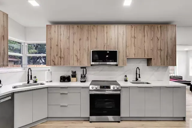 a kitchen with a table and chairs in it
