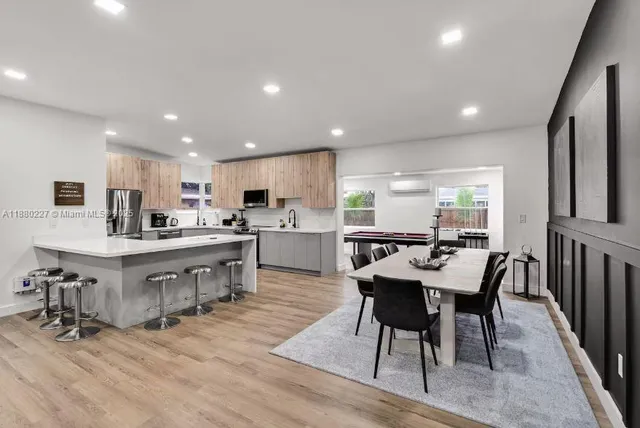 a dining room with furniture and window