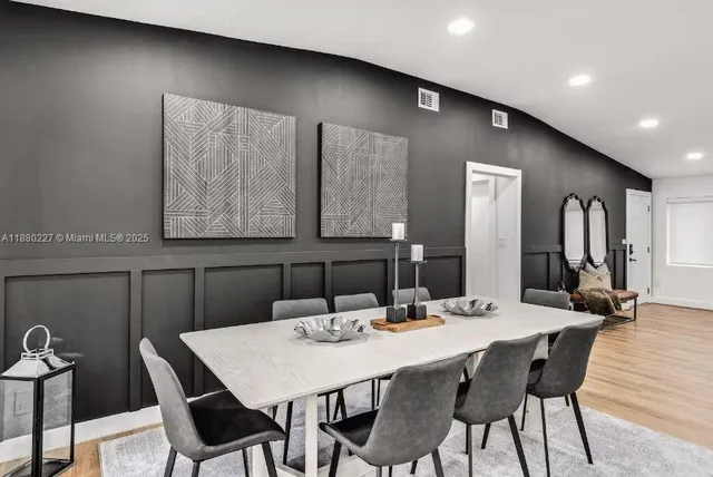 a bedroom with a bed and a mirror