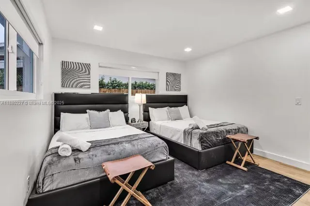 a bedroom with a bed and chair