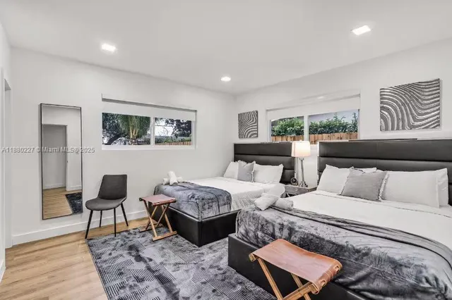 a bed room with a bed and a night stand