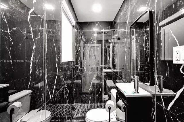 a view of a backyard with wooden floor and fence