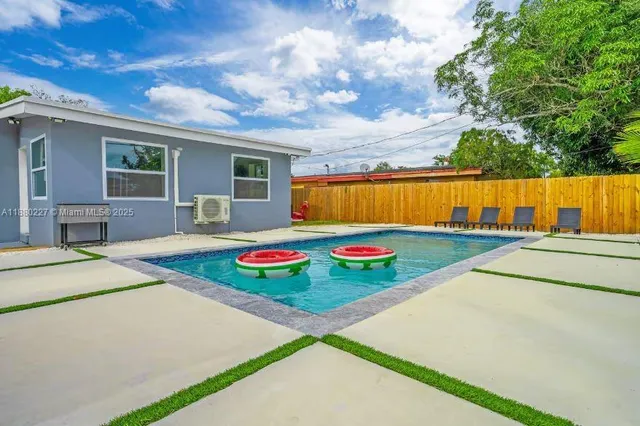 a view of a table and chairs under an umbrella