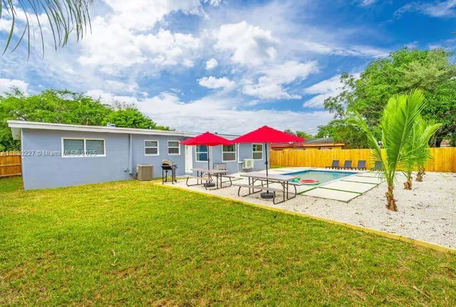 a view of a hallway with washer and dryer