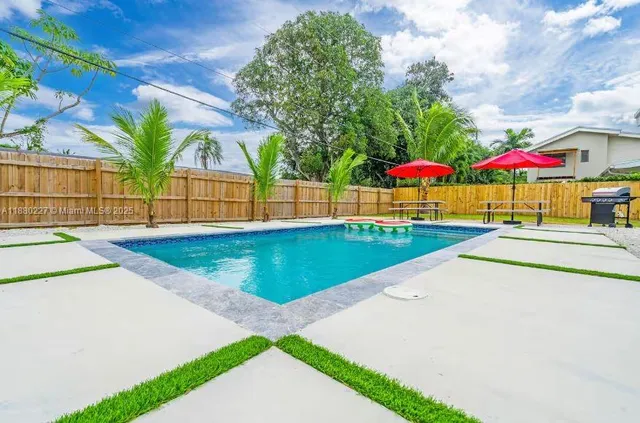 a view of house with a yard