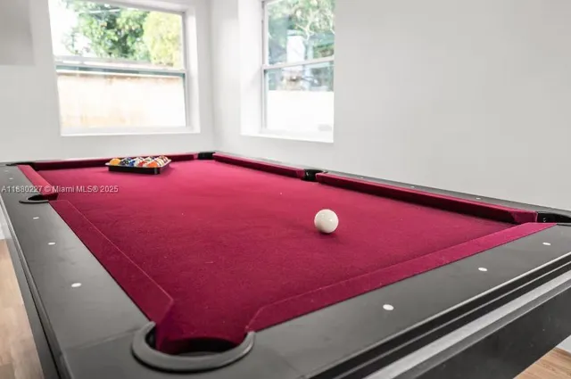 a close up of a white wall with a white door