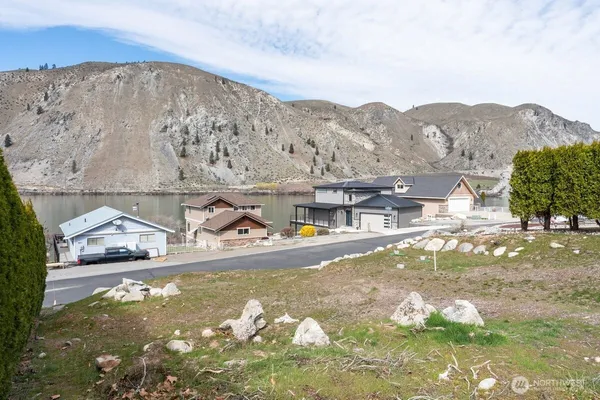 a view of swimming pool with a mountain in the background