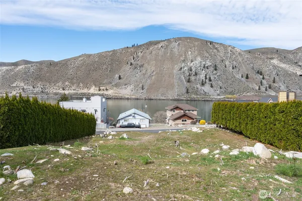 a view of a tiny house with a yard