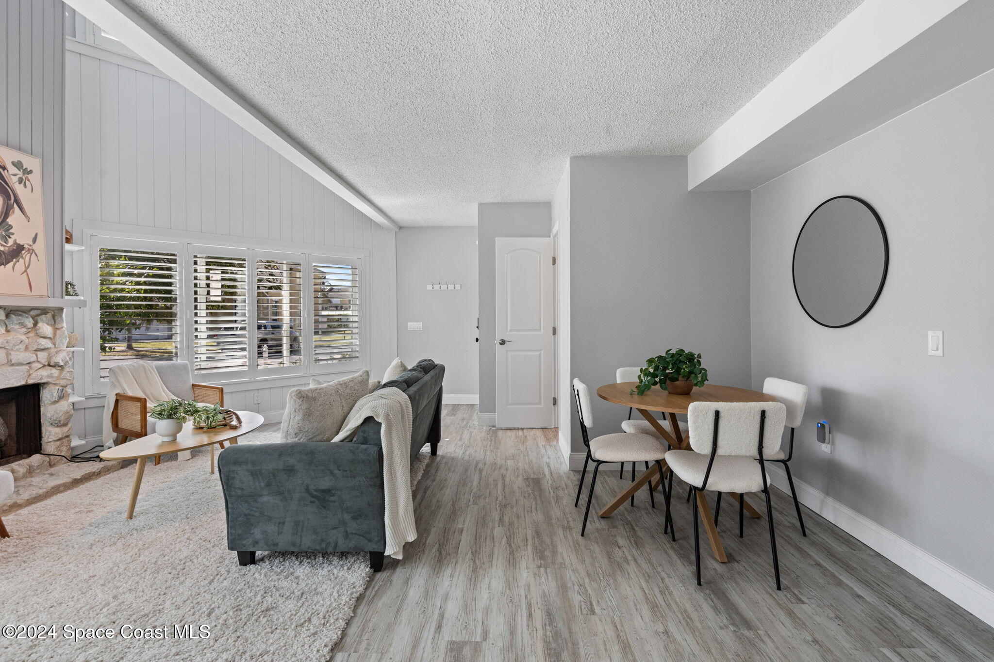 654 Cedar Side Circle Northeast Palm Bay, FL 32905 - Photo 11 of 35 a living room with furniture and a large window