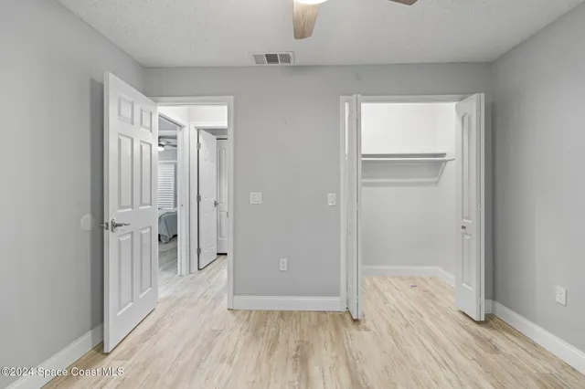 a view of a bathroom with wooden floor