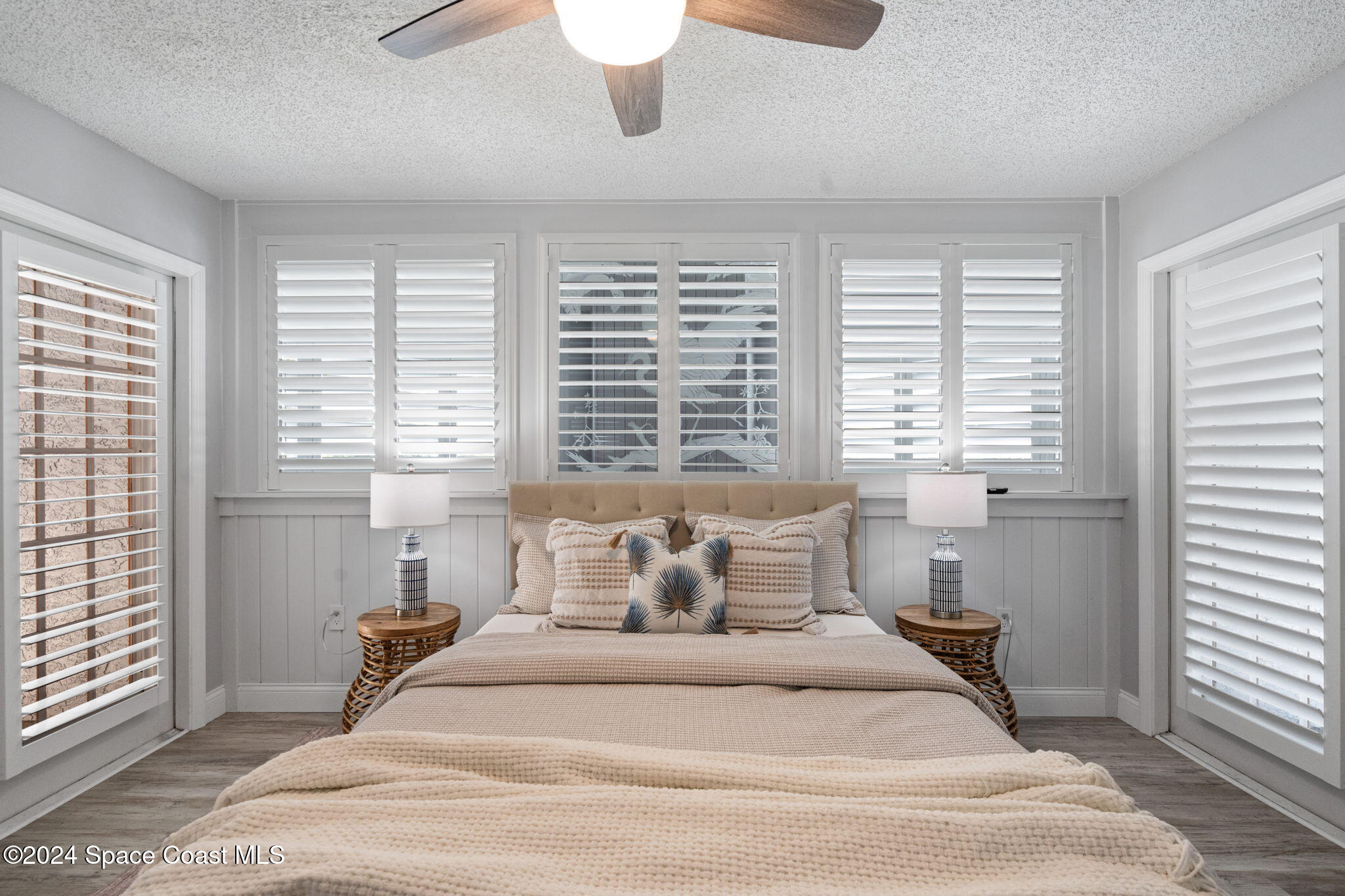 654 Cedar Side Circle Northeast Palm Bay, FL 32905 - Photo 22 of 35 a bedroom with a large bed and a window