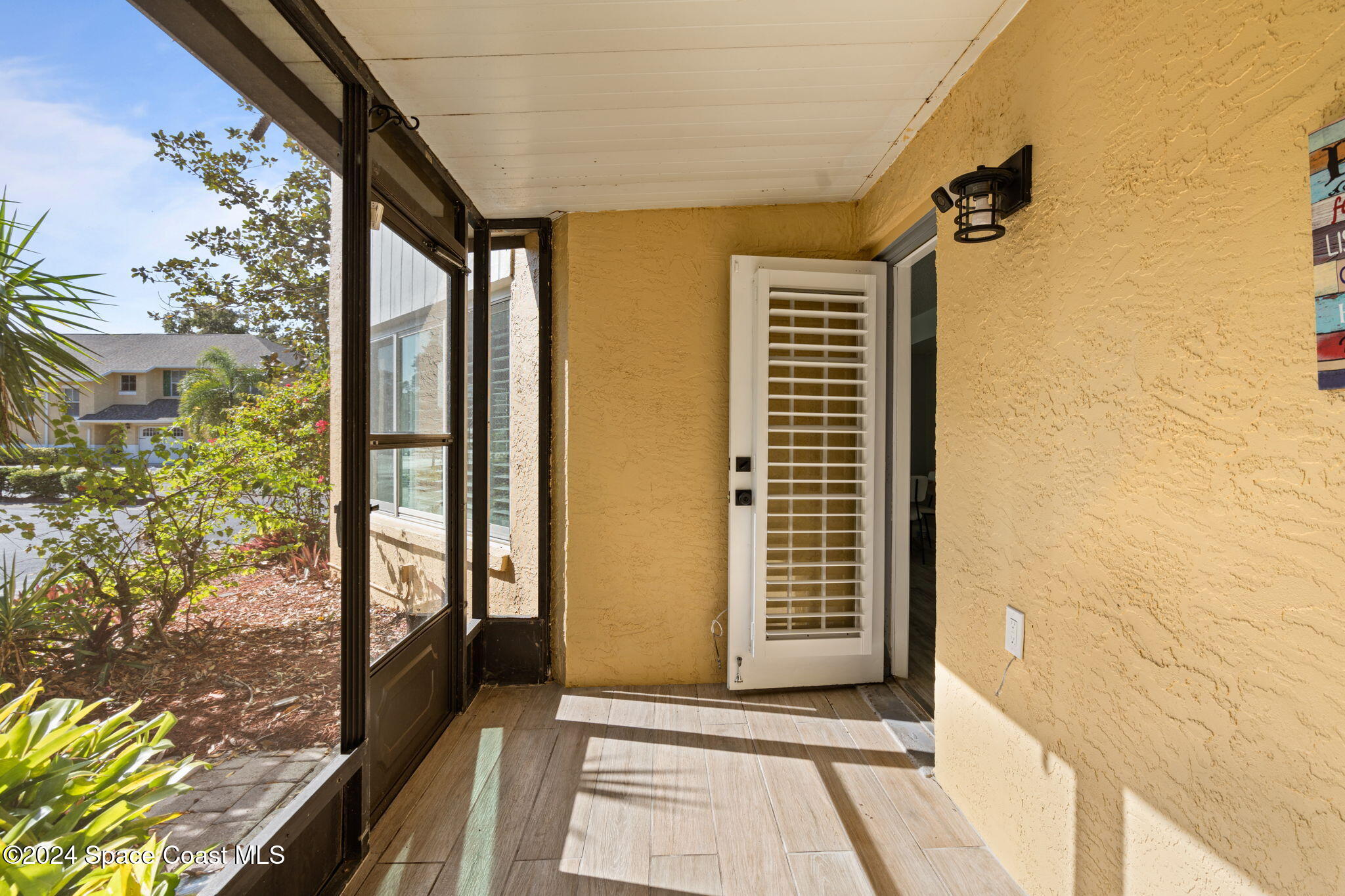 654 Cedar Side Circle Northeast Palm Bay, FL 32905 - Photo 29 of 35 a view of a bathroom with a glass door