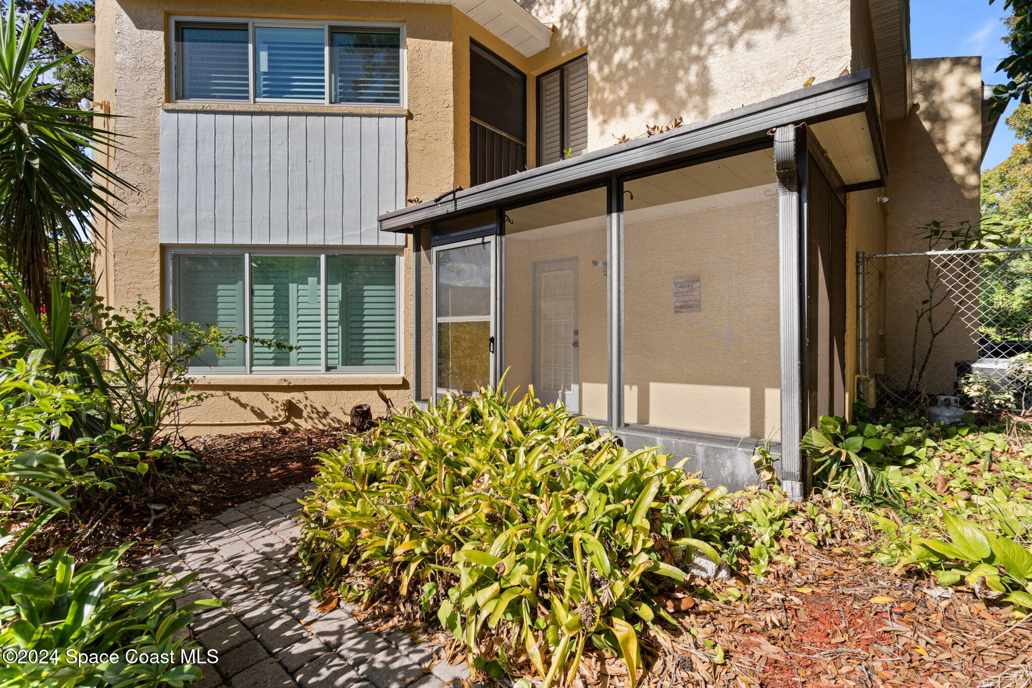654 Cedar Side Circle Northeast Palm Bay, FL 32905 - Photo 30 of 35 front view of a house with a yard