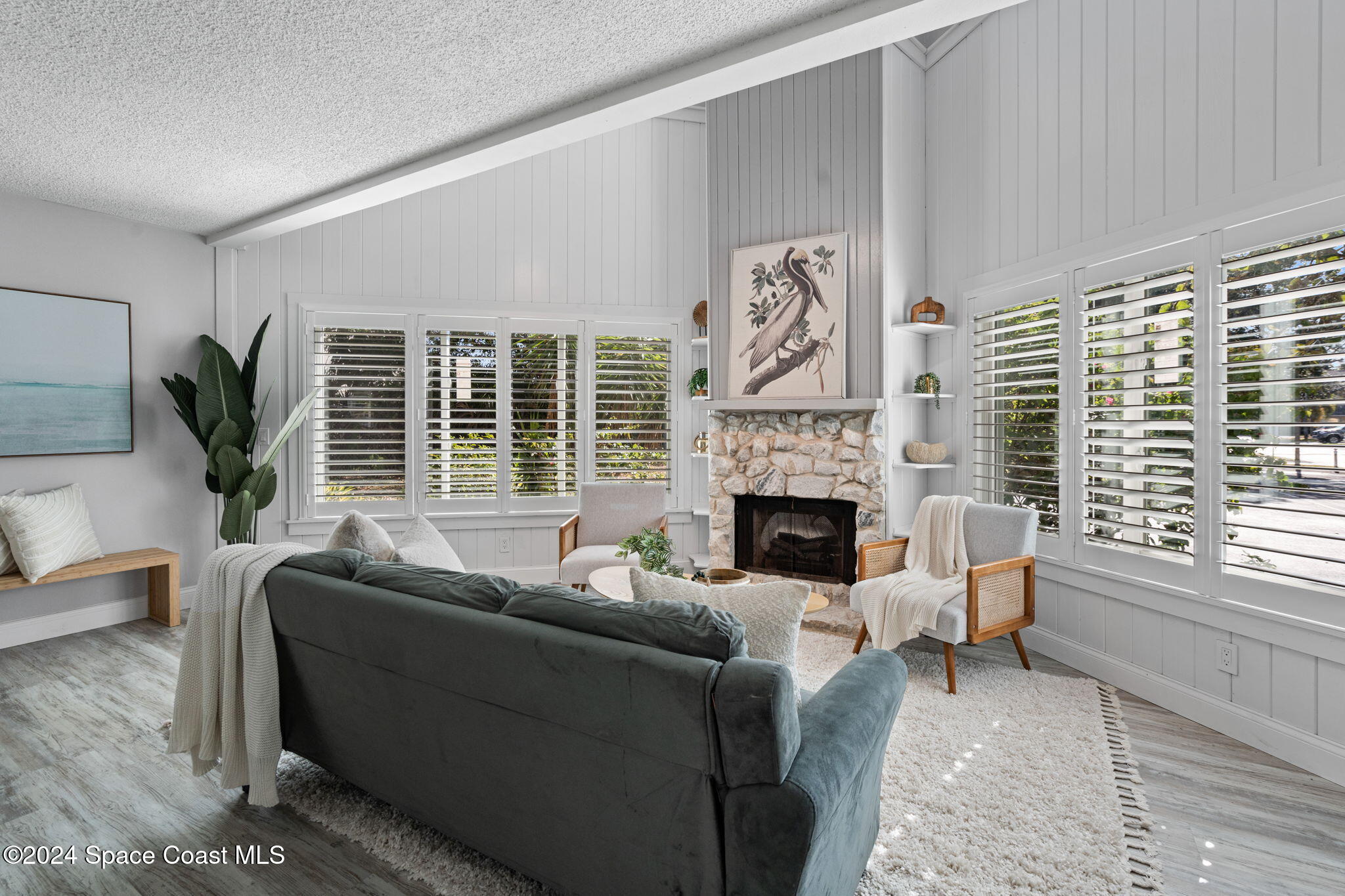 654 Cedar Side Circle Northeast Palm Bay, FL 32905 - Photo 6 of 35 a living room with furniture and a large window