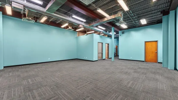a kitchen with granite countertop white cabinets and stainless steel appliances