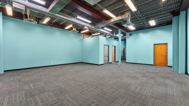 a kitchen with granite countertop white cabinets and stainless steel appliances
