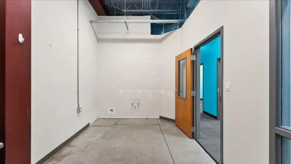 a view of entryway with a window and wooden floor