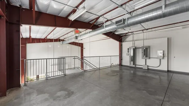 a view of an empty room with stairs