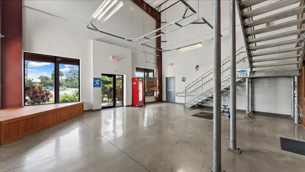 a view of an empty room with stairs