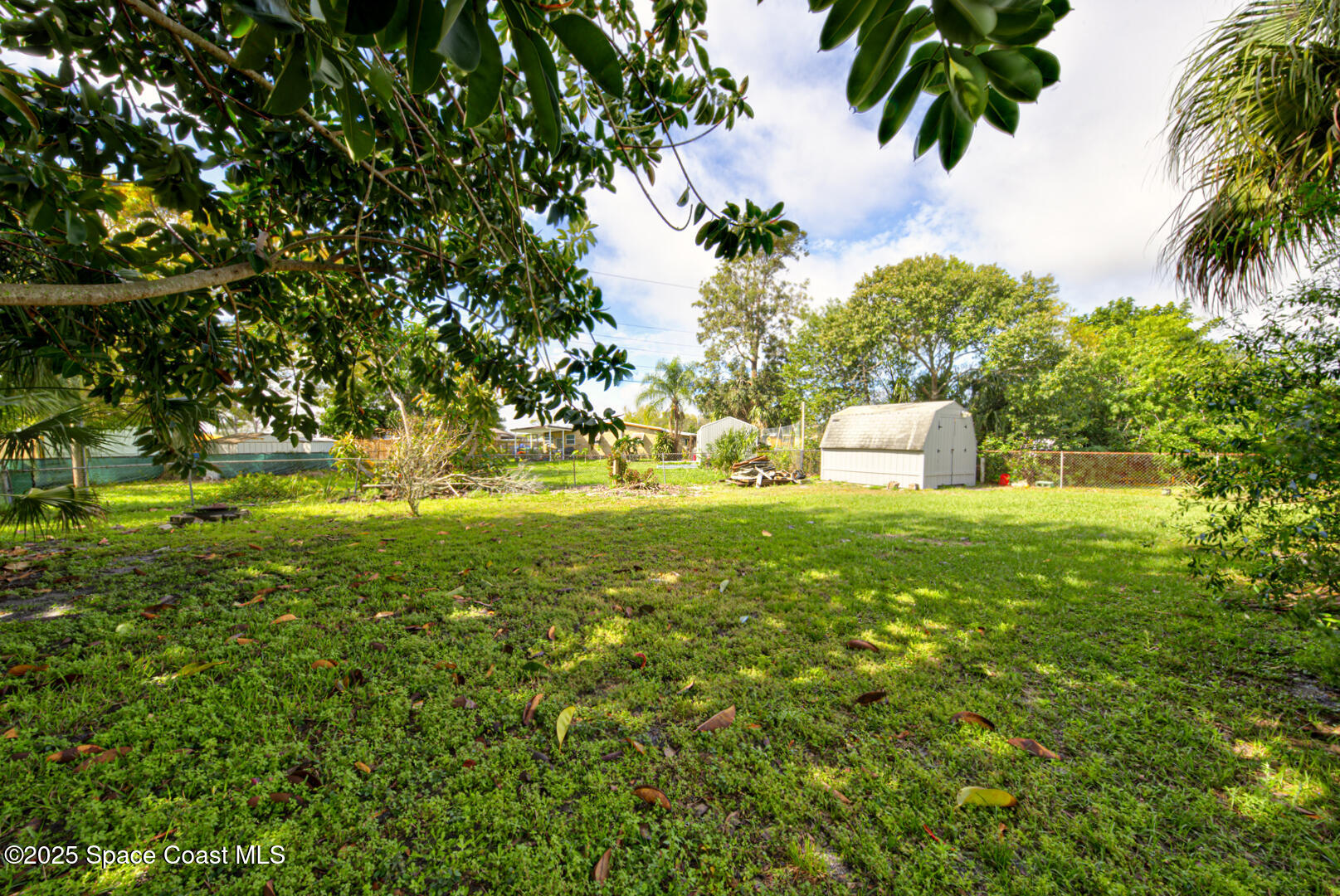 2433 Allan Adale Road Melbourne, FL 32935 - Photo 27 of 29 backyard with shed