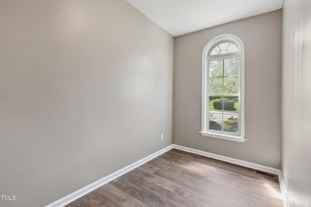 a view of an entryway with wooden floor