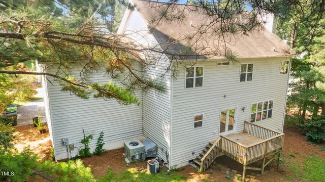 a view of a house with a yard and sitting area