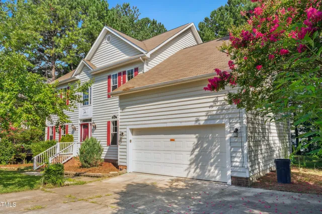 a kitchen with stainless steel appliances granite countertop a sink a stove a microwave and cabinets