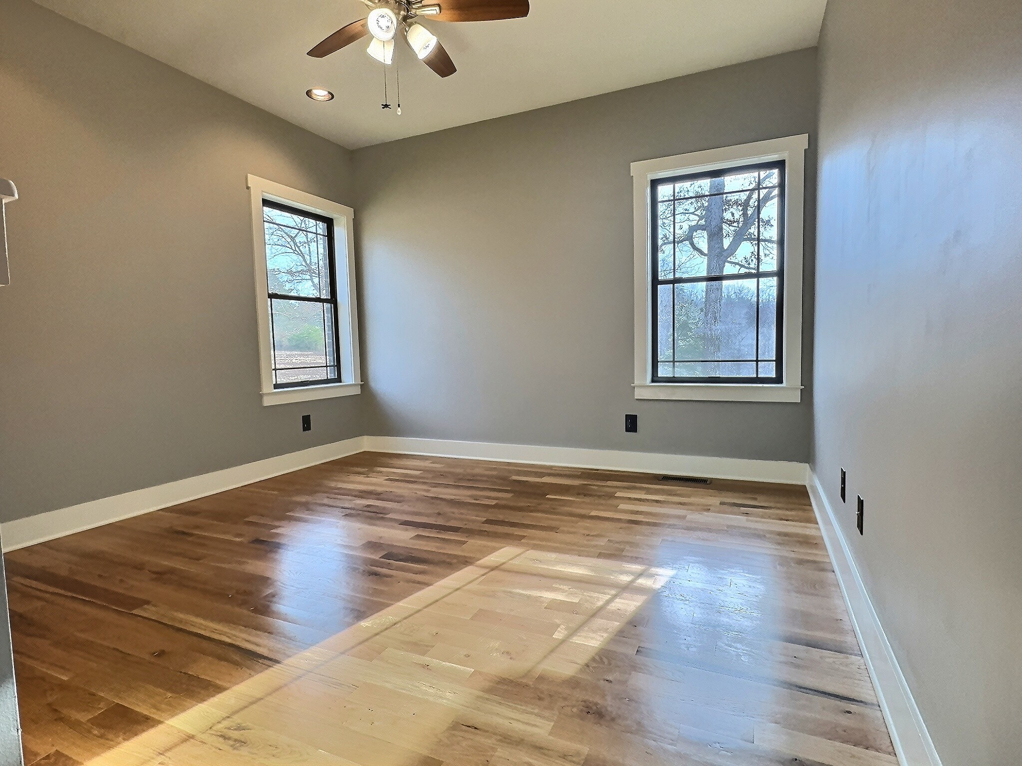 7307 Brush Creek Road Fairview, TN 37062 - Photo 11 of 41 a view of an empty room with window and wooden floor