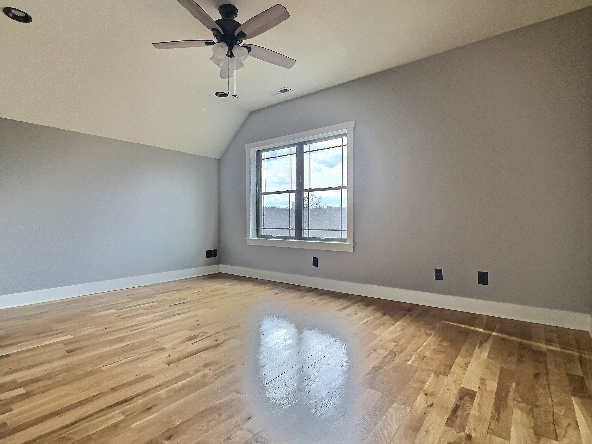 7307 Brush Creek Road Fairview, TN 37062 - Photo 12 of 41 wooden floor in an empty room with a window