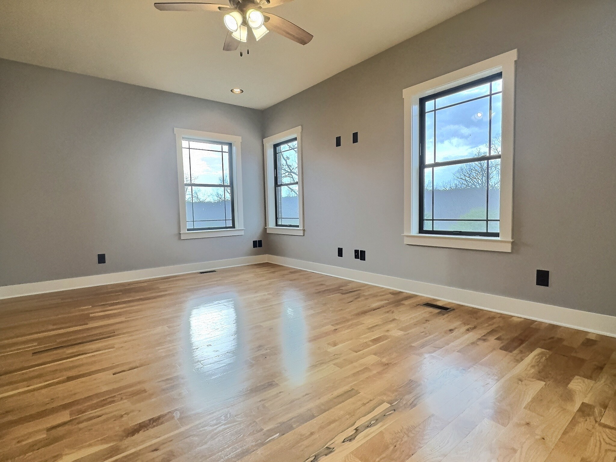 7307 Brush Creek Road Fairview, TN 37062 - Photo 18 of 41 a view of an empty room with wooden floor and a window