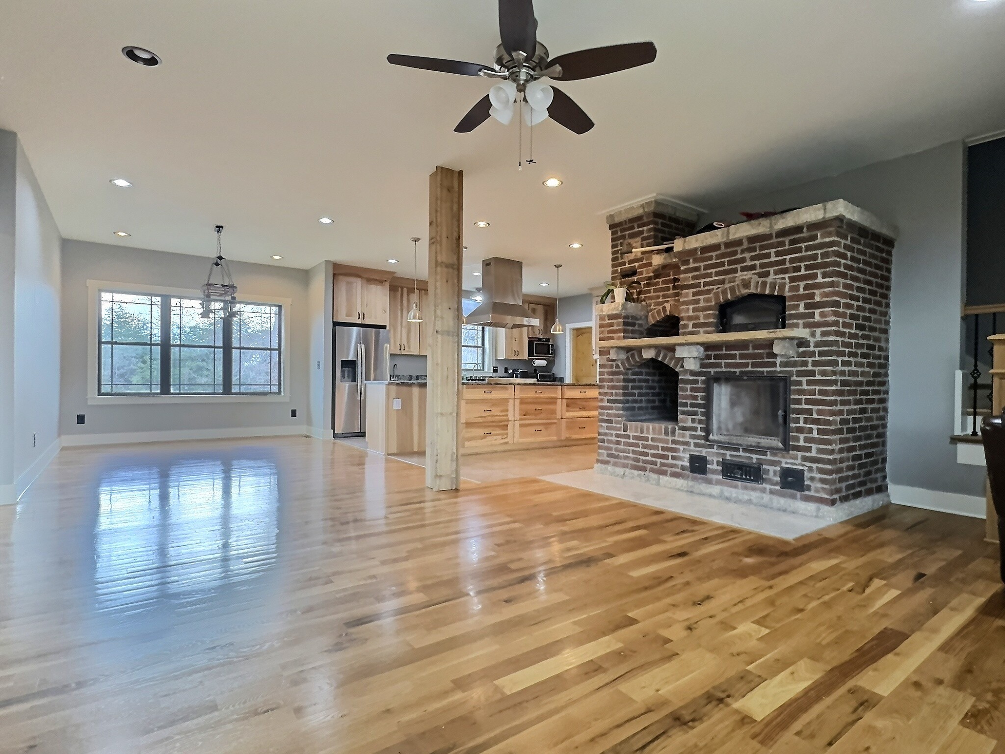 7307 Brush Creek Road Fairview, TN 37062 - Photo 2 of 41 a view of a livingroom with wooden floor and a fireplace