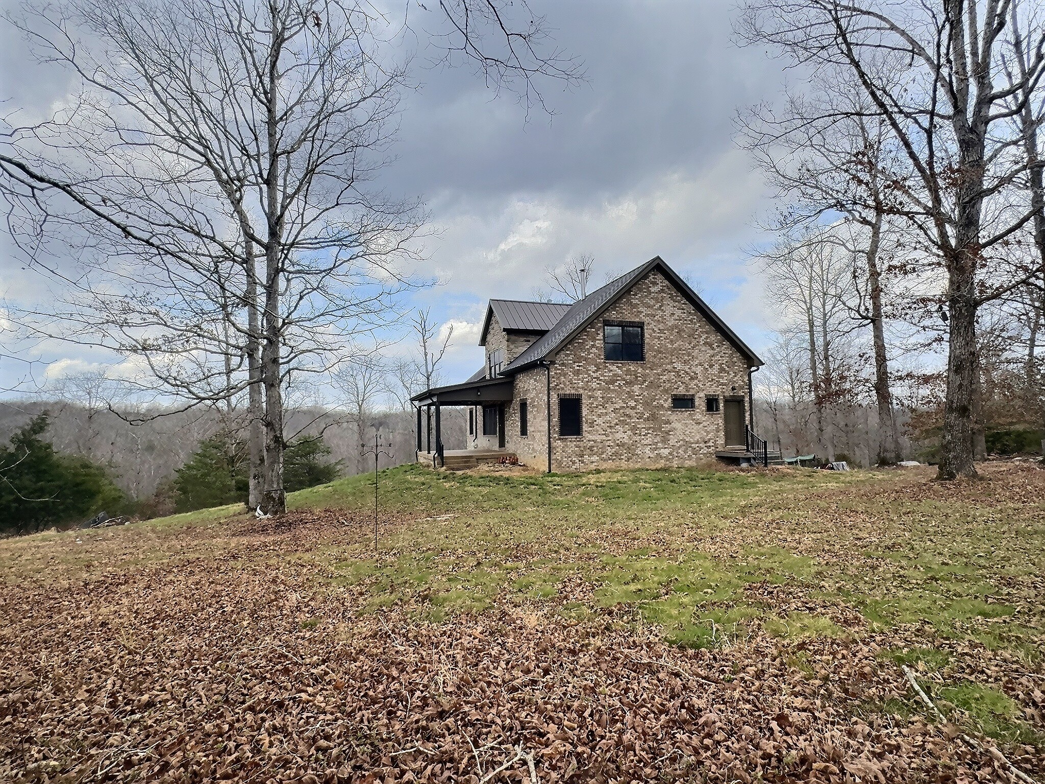 7307 Brush Creek Road Fairview, TN 37062 - Photo 24 of 41 a house with trees in the background
