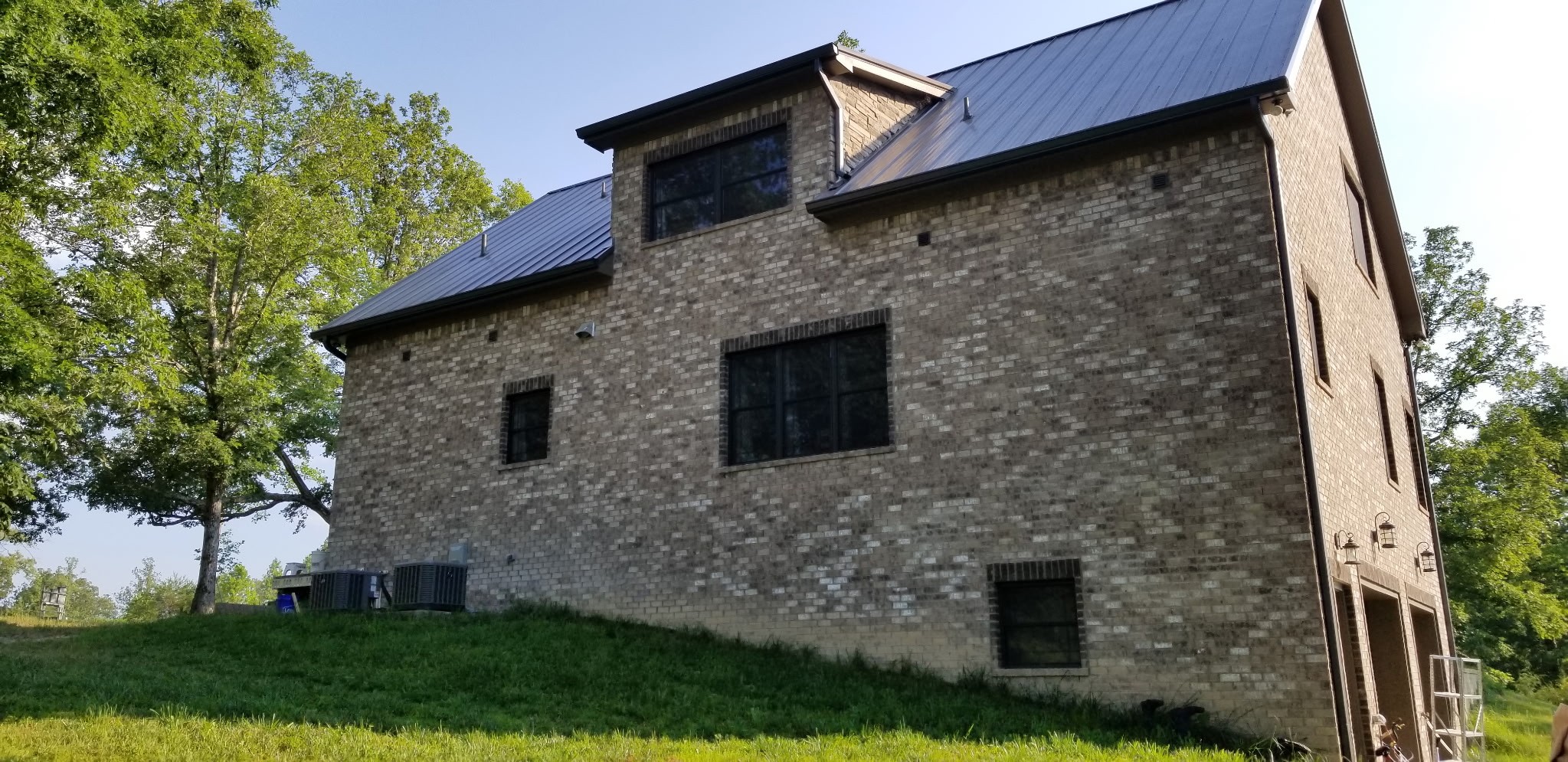7307 Brush Creek Road Fairview, TN 37062 - Photo 26 of 41 a brick building with a small yard