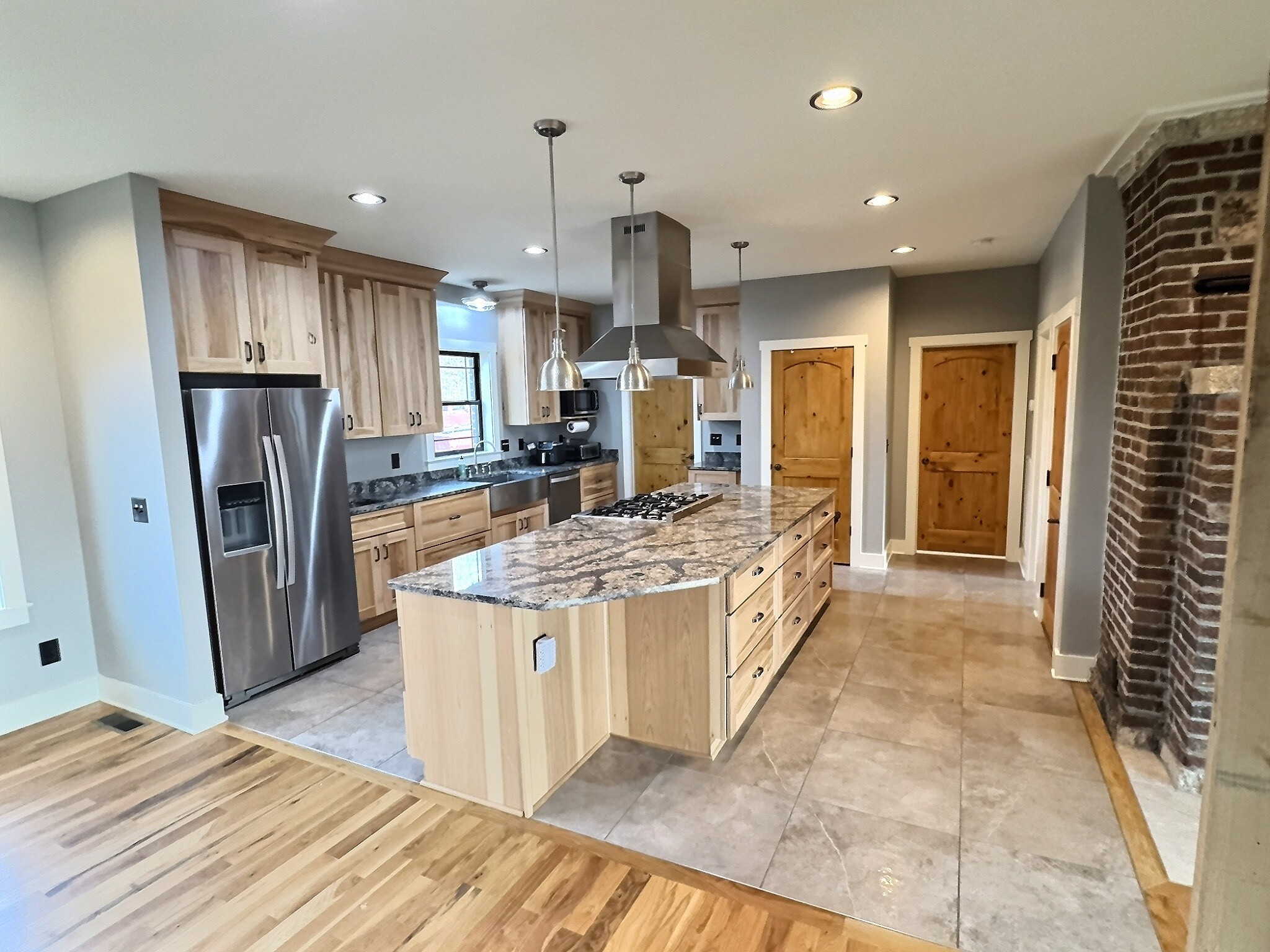 7307 Brush Creek Road Fairview, TN 37062 - Photo 4 of 41 a large kitchen with a stove a refrigerator a sink a oven and a wooden cabinets