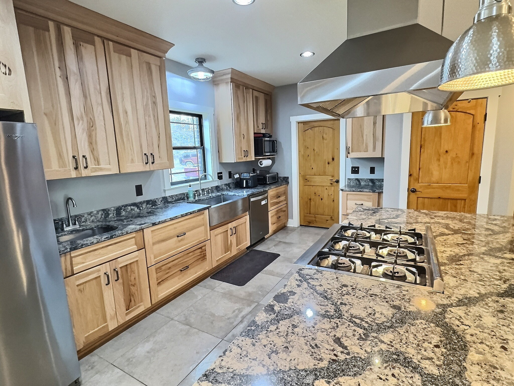 7307 Brush Creek Road Fairview, TN 37062 - Photo 5 of 41 a kitchen with stainless steel appliances a stove a sink and a refrigerator