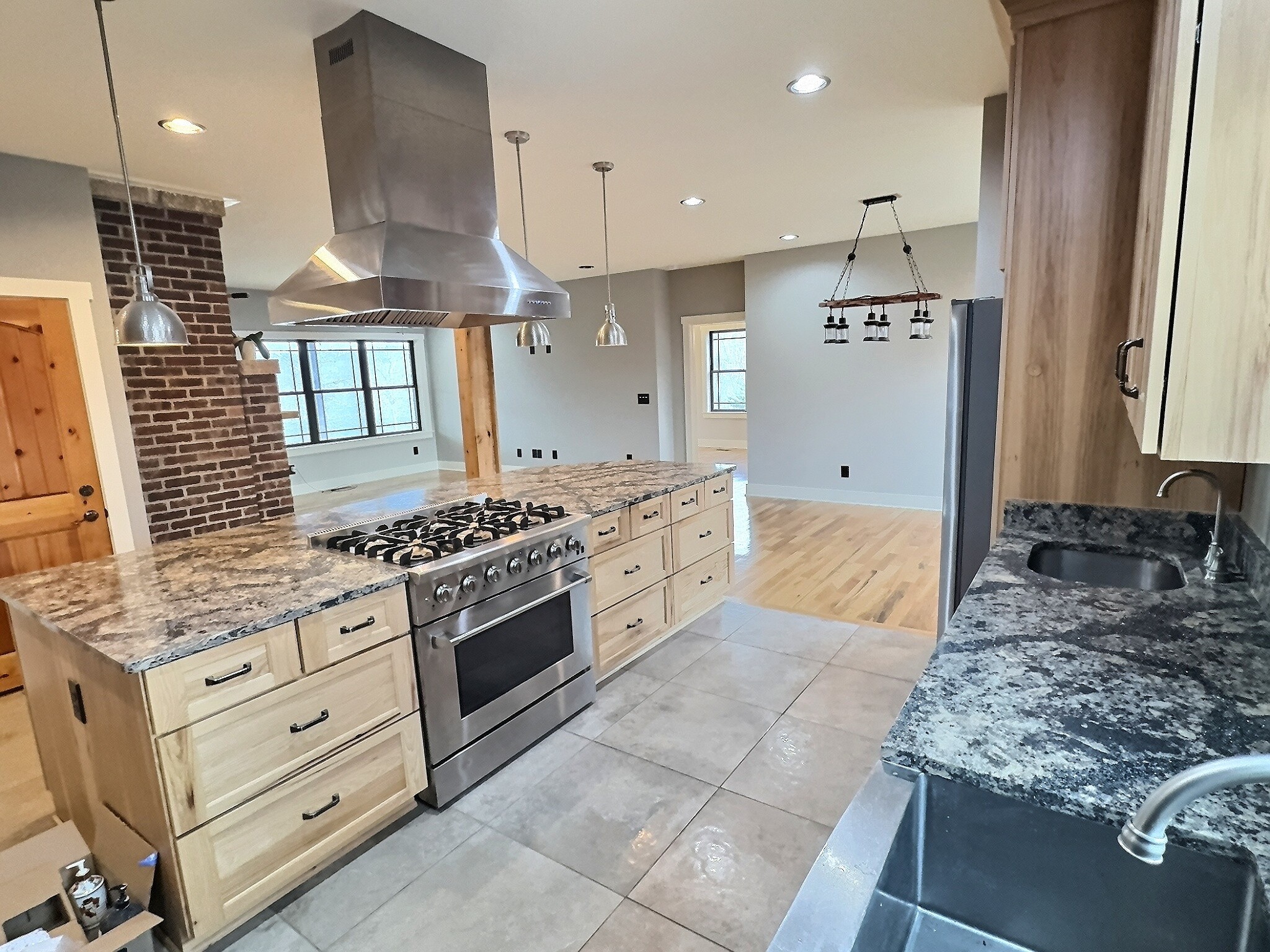 7307 Brush Creek Road Fairview, TN 37062 - Photo 6 of 41 a kitchen with stainless steel appliances granite countertop a stove a sink and a refrigerator
