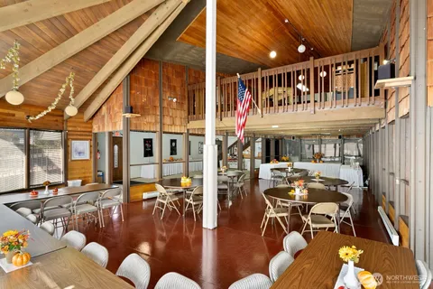 a living room with lots of furniture and white walls