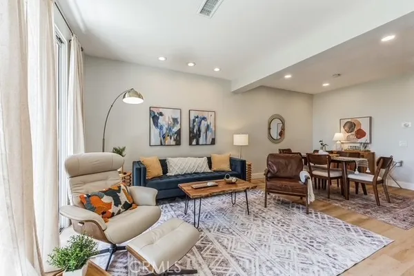 a living room with furniture and a rug
