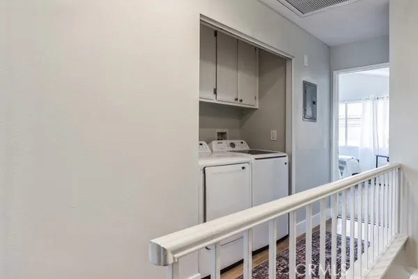 a kitchen with cabinets and window