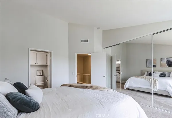 a bedroom with a bed and closet