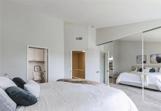 a bedroom with a bed and closet