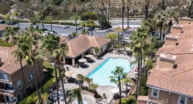an aerial view of a houses with yard